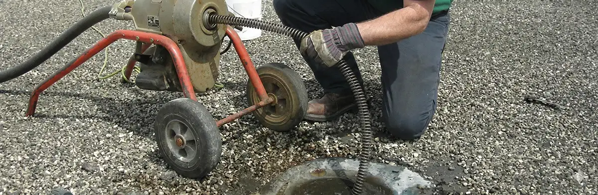 sewer rodding technician actively removing blockages from a sewer line in San Jose, CA